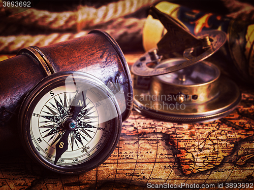 Image of Old vintage compass on ancient map