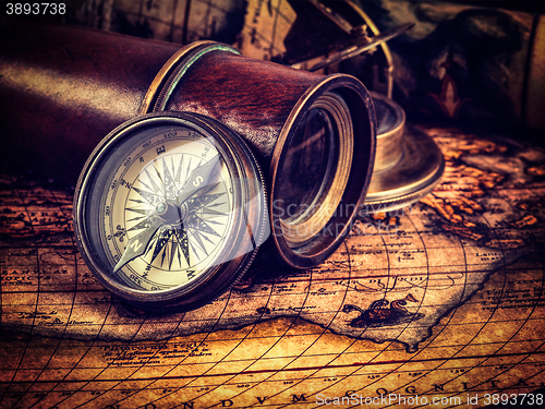 Image of Old vintage compass on ancient map