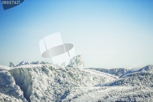 Image of White gypsum mountain under the blue sky