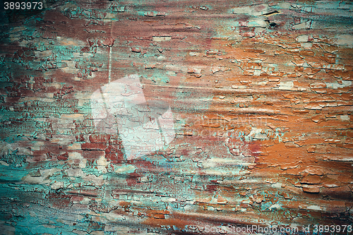 Image of Cracked paint on a wooden plank