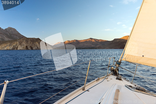 Image of Prow of sailing boat and seacoast