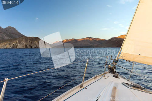 Image of Prow of sailing boat and seacoast