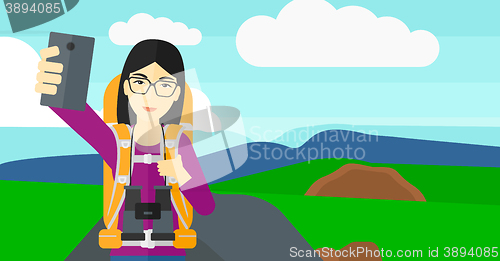 Image of Backpckaer making selfie.