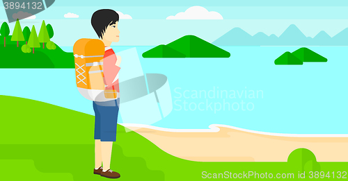 Image of Man with backpack hiking.