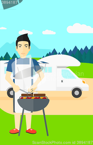 Image of Man preparing barbecue.