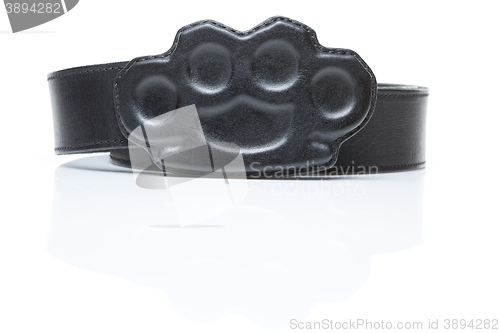 Image of black belt with a buckle in the form of brass knuckles