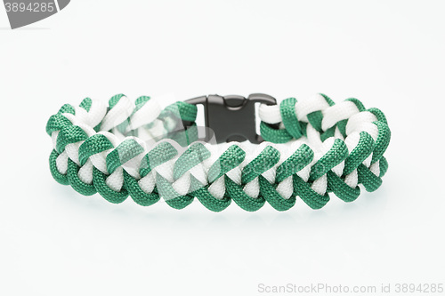 Image of green braided bracelet on white background