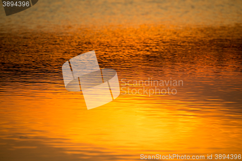 Image of spring sunset reflecting in water