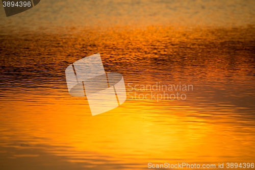 Image of spring sunset reflecting in water