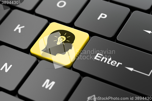 Image of Advertising concept: Head With Light Bulb on computer keyboard background