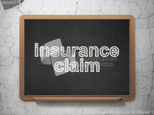Image of Insurance concept: Insurance Claim on chalkboard background