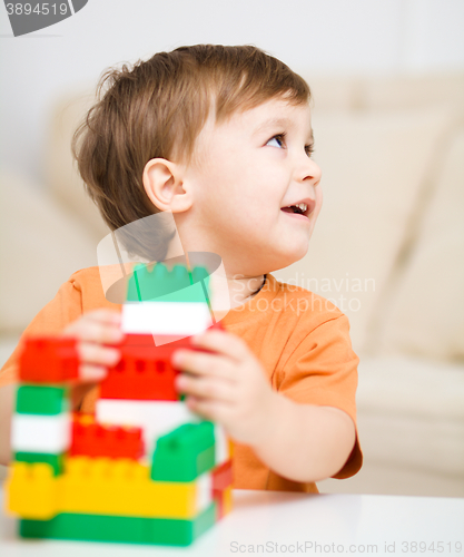 Image of Boy is playing with building blocks