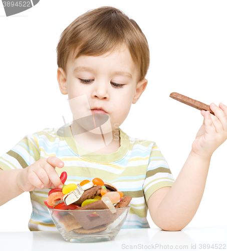 Image of Portrait of a boy with cookies