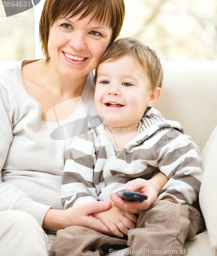 Image of Mother and her son are watching tv