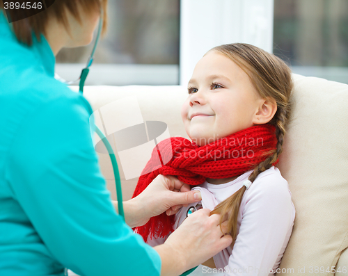 Image of Doctor is examining little girl using stethoscope