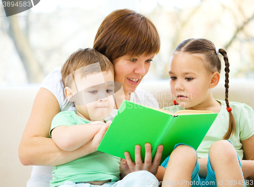 Image of Family is reading book