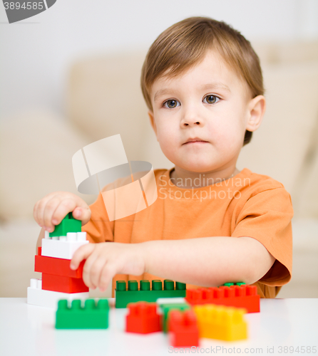 Image of Boy is playing with building blocks