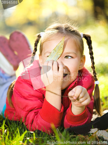 Image of Portrait of a little girl in autumn park