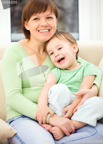 Image of Mother is having fun with her son