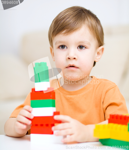 Image of Boy is playing with building blocks