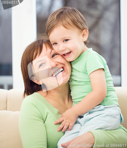 Image of Mother is having fun with her son