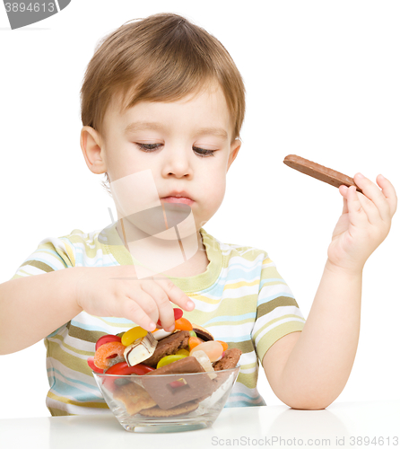Image of Portrait of a boy with cookies