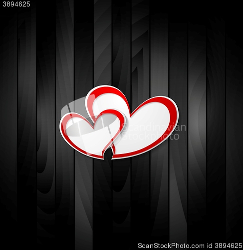 Image of Valentine hearts on black wooden texture background