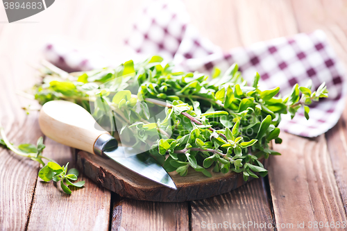 Image of marjoram on a wooden rustic table