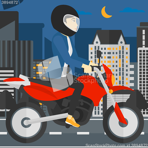 Image of Woman riding motorcycle.