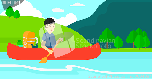 Image of Man canoeing on the river.