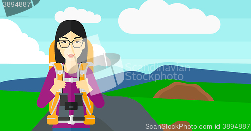 Image of Cheerful backpacker with binoculars.