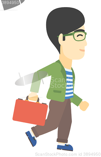 Image of Businessman walking with briefcase.