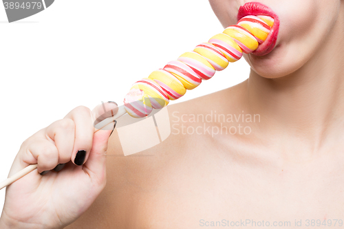 Image of Close-up shot of woman\'s mouth bright red lips with lollipop. blowjob simulation