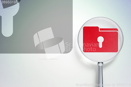 Image of Business concept:  Folder With Keyhole with optical glass on digital background