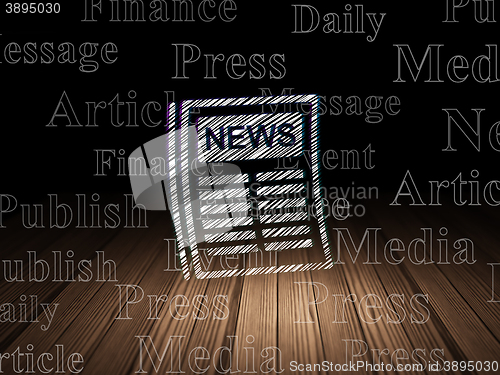 Image of News concept: Newspaper in grunge dark room