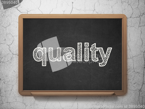 Image of Advertising concept: Quality on chalkboard background