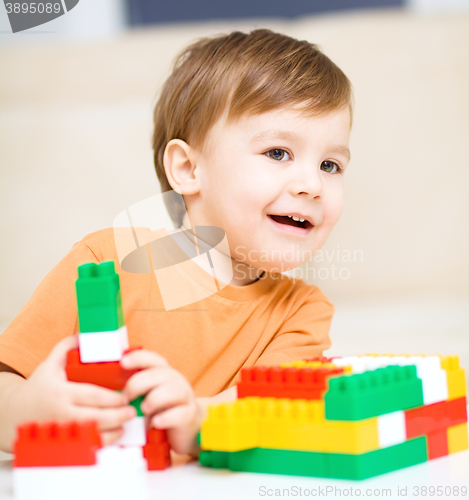 Image of Boy is playing with building blocks