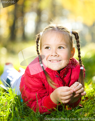 Image of Portrait of a little girl in autumn park