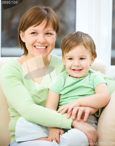Image of Mother is having fun with her son