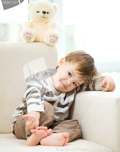 Image of Portrait of a little boy with his teddy bear