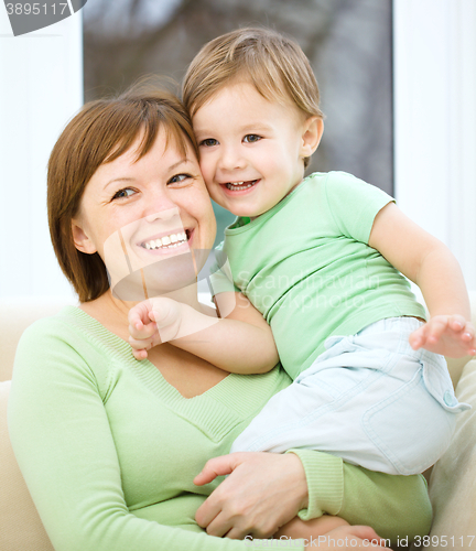 Image of Mother is having fun with her son