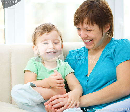 Image of Mother is having fun with her son