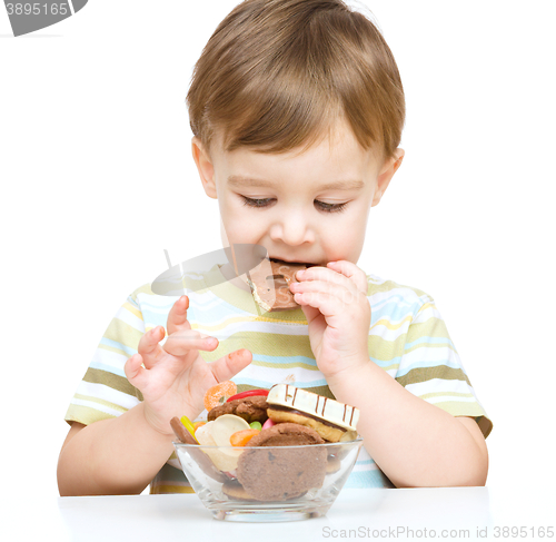 Image of Portrait of a boy with cookies