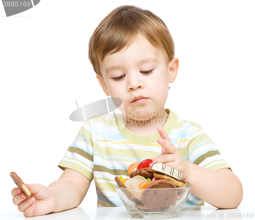 Image of Portrait of a boy with cookies