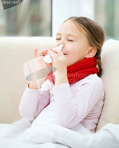 Image of Little girl spraying her nose