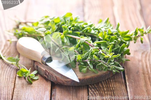 Image of marjoram on a wooden rustic table