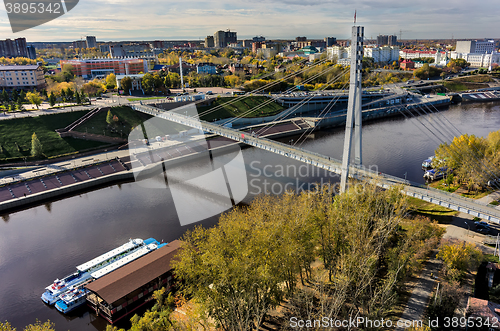 Image of Pedestrian Lovers Bridge on Tura river. Tyumen