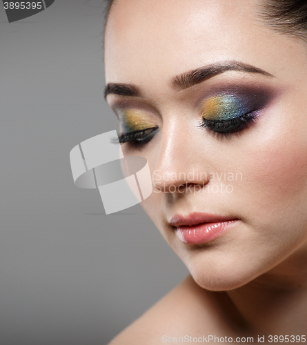 Image of Close up portrait of beautiful young woman face. Makeup concept.