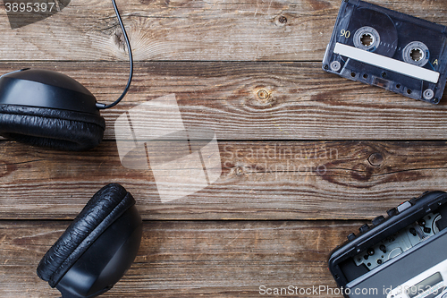 Image of Cassette tapes, player and headphones . Top view.