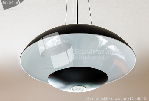 Image of Elegant ceiling lamp with glass lampshade.